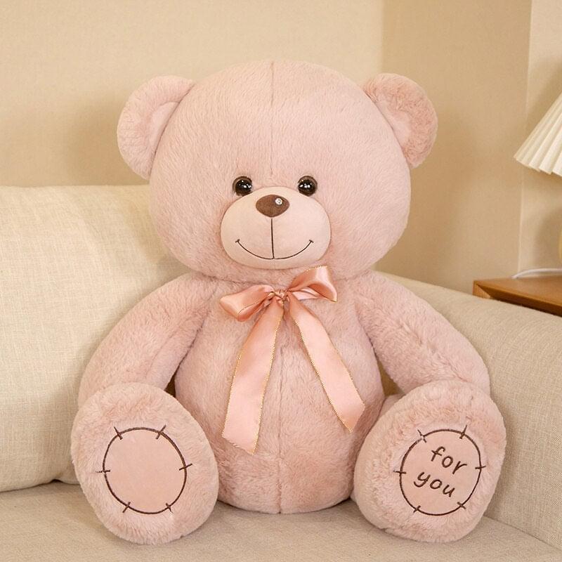 Soft stuffed bear with warm smile, seated and huggable | Pink color